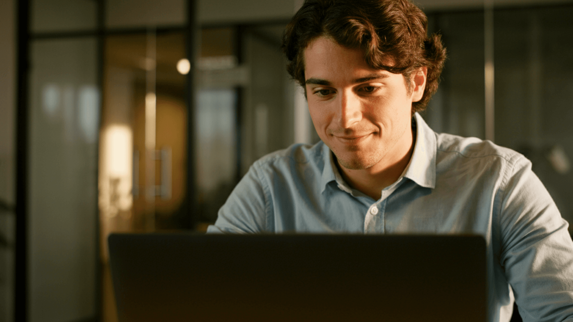 man using laptop at desk